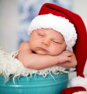Portrait Of A Newborn Baby Boy,  Wearing Christmas Hat, Sleeping